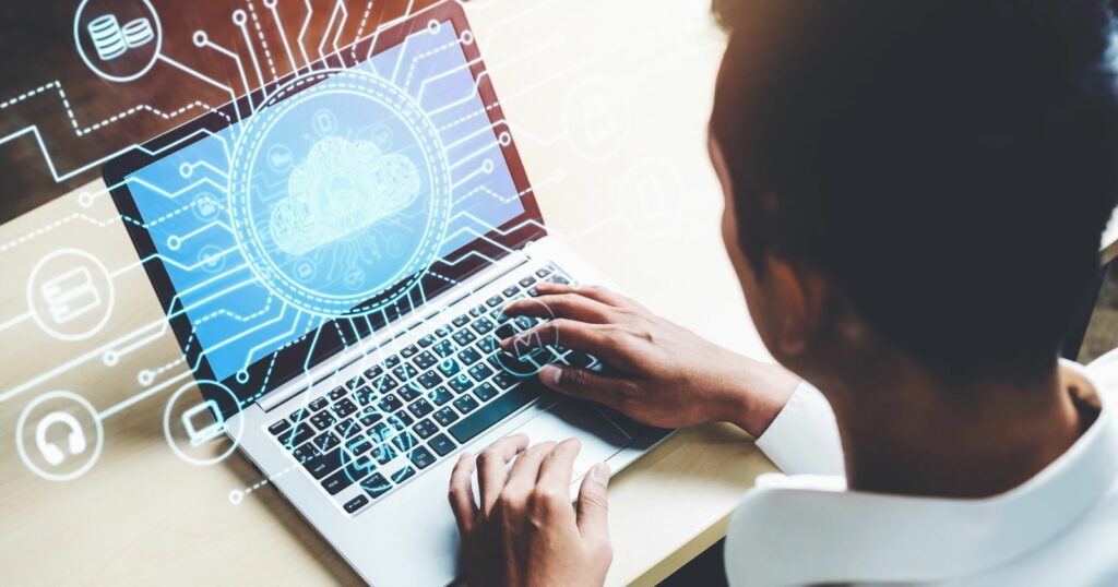 Laptop user accessing diverse cloud computing data.